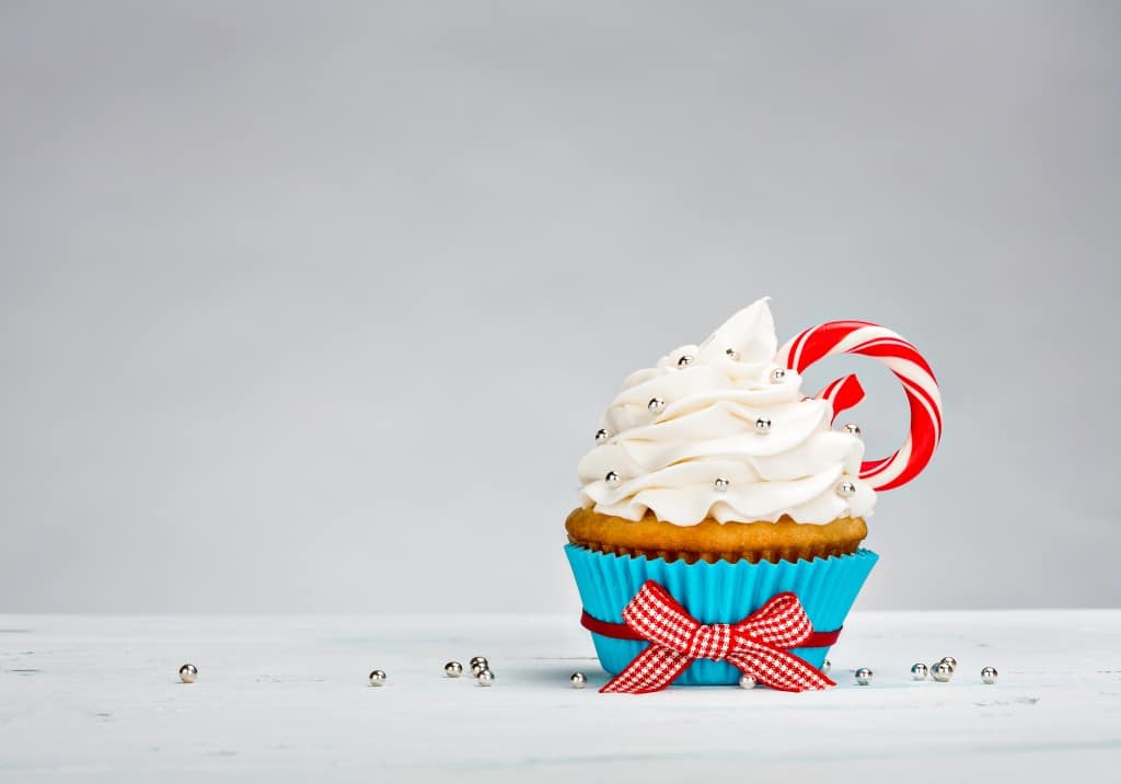 Cupcake with a peppermint stick.